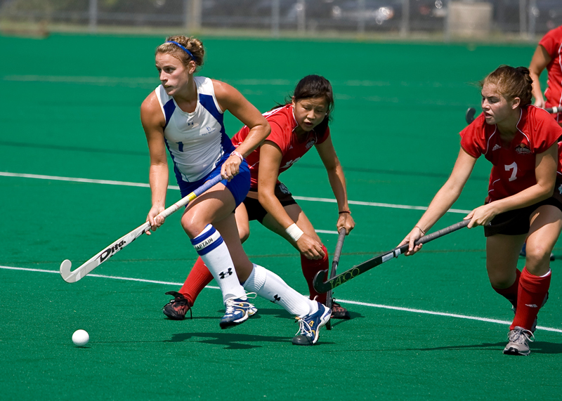 Student-athletes compete in a field hockey match