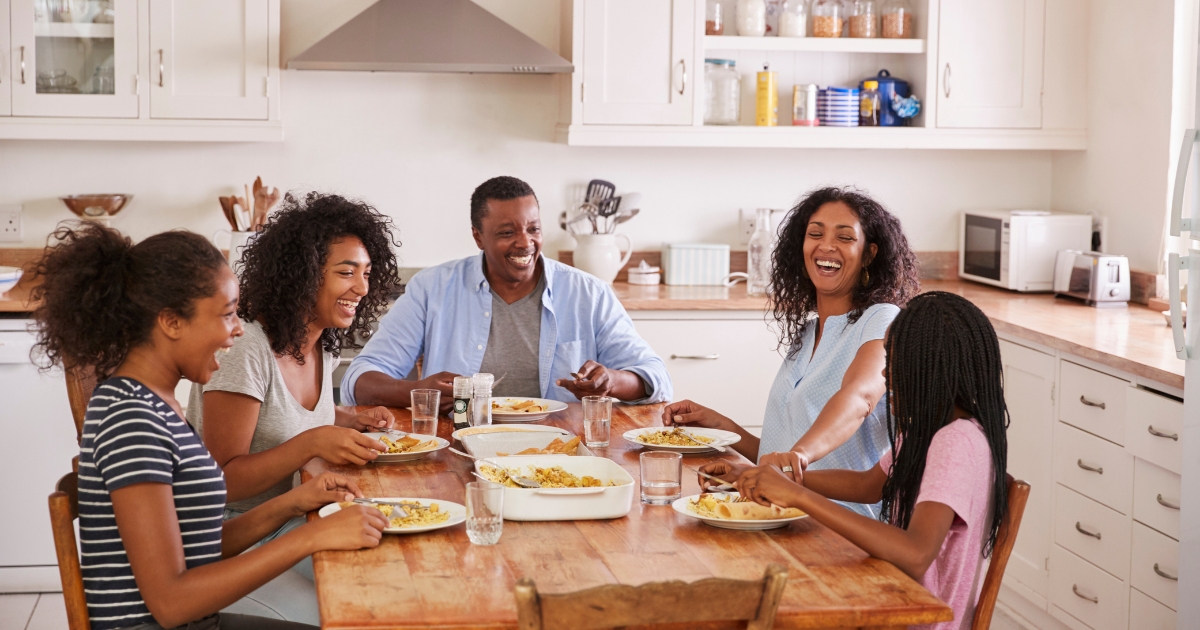 A family of five having a meal together