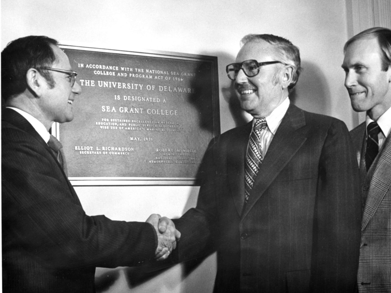 Officials in front of newly installed plaque recognizing UD as a Sea Grant college (1976)