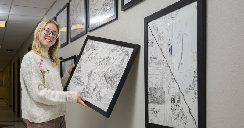 “Art has always been an outlet to help figure out who I am, what I like to do, and how I see other people,” said Morgan Oliver, whose drawing of her study abroad experience in the Amazon now hangs in Townsend Hall. “Art has always been an outlet to help figure out who I am, what I like to do, and how I see other people,” said Morgan Oliver, whose drawing of her study abroad experience in the Amazon now hangs in Townsend Hall.