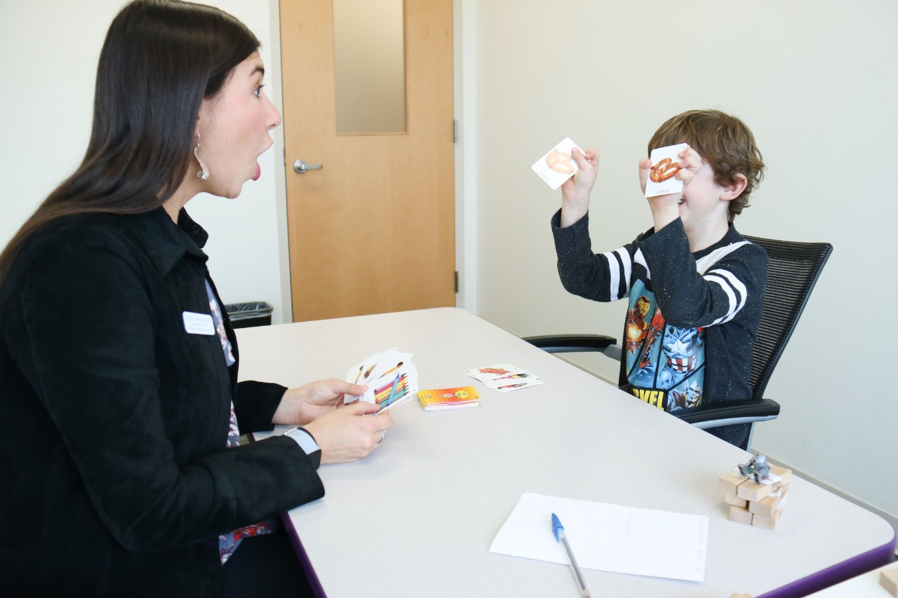 Speech Language Pathologist working with a child in the Speech Language Hearing Clinic