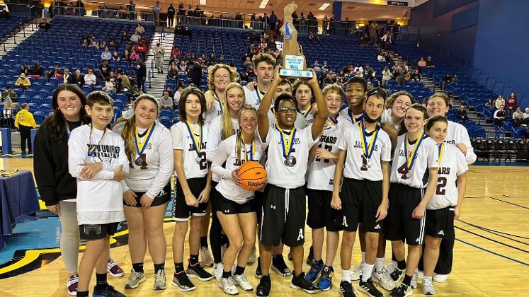 University of Delaware sophomore Autumn Gentry (far left), who coaches the Appoquinimink Unified Basketball team, poses with her team after it took home the runner-up trophy in the championship game on March 11, 2022.