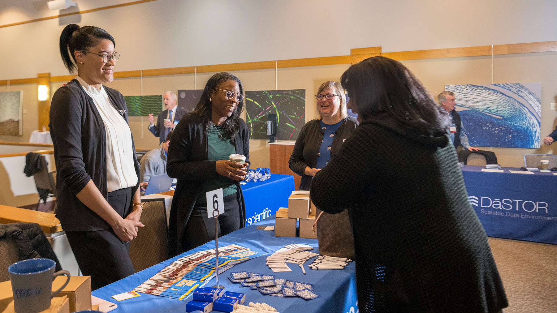 Prospective customers speak to a supplier at the supplier diversity conference