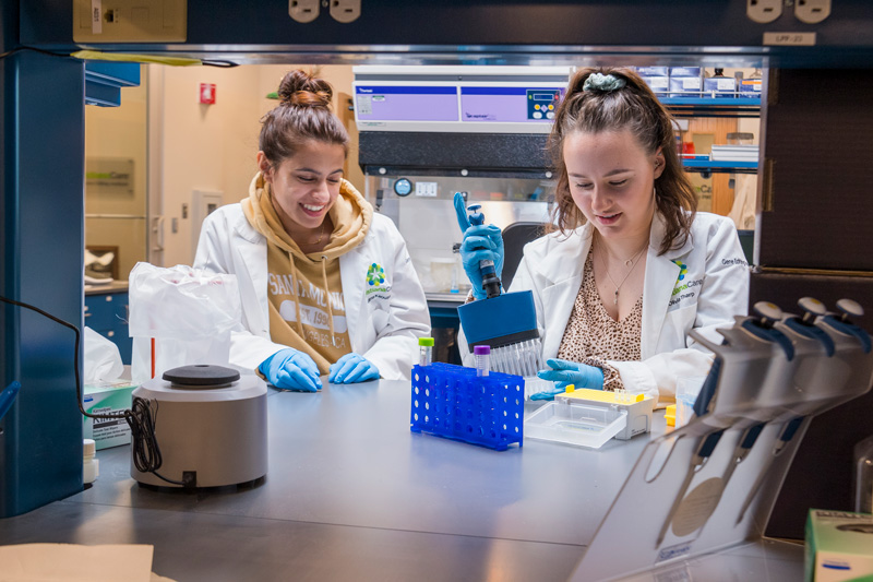 During her student internship at ChristianaCare’s Gene Editing Institute, located on the University of Delaware’s STAR Campus, Sophia Masciarelli (right) got to use CRISPR gene editing technology, which holds great promise in the treatment, cure and prevention of genetic diseases. She is shown with one of her mentors, staff scientist Salma Kaouser, who earned her bachelor’s degree in biotechnology and biological sciences from UD in 2020.