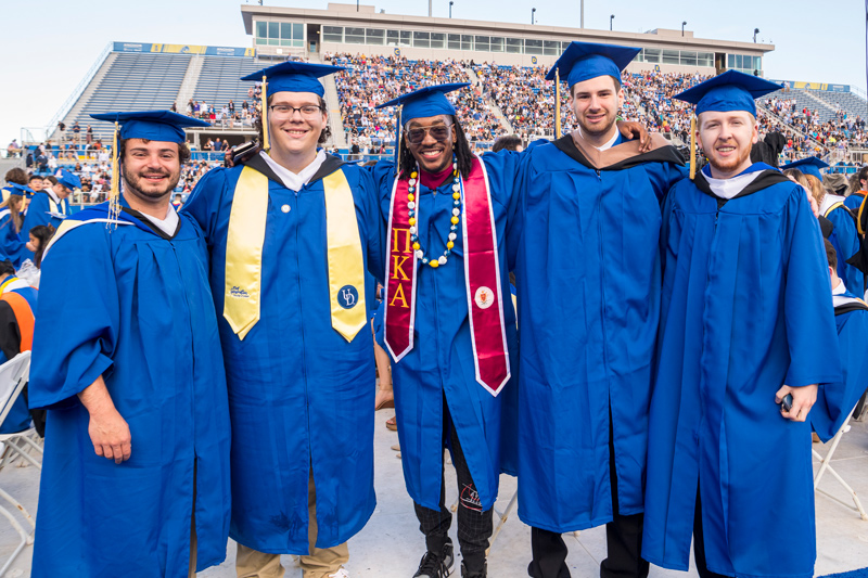 From left to right, Daniel Julis (psychology), Luke Biddle (biology), Christopher Howell (human services), Matt Lax (finance) and Kyle McDonald (communications) attend Commencement on Saturday, May 28.