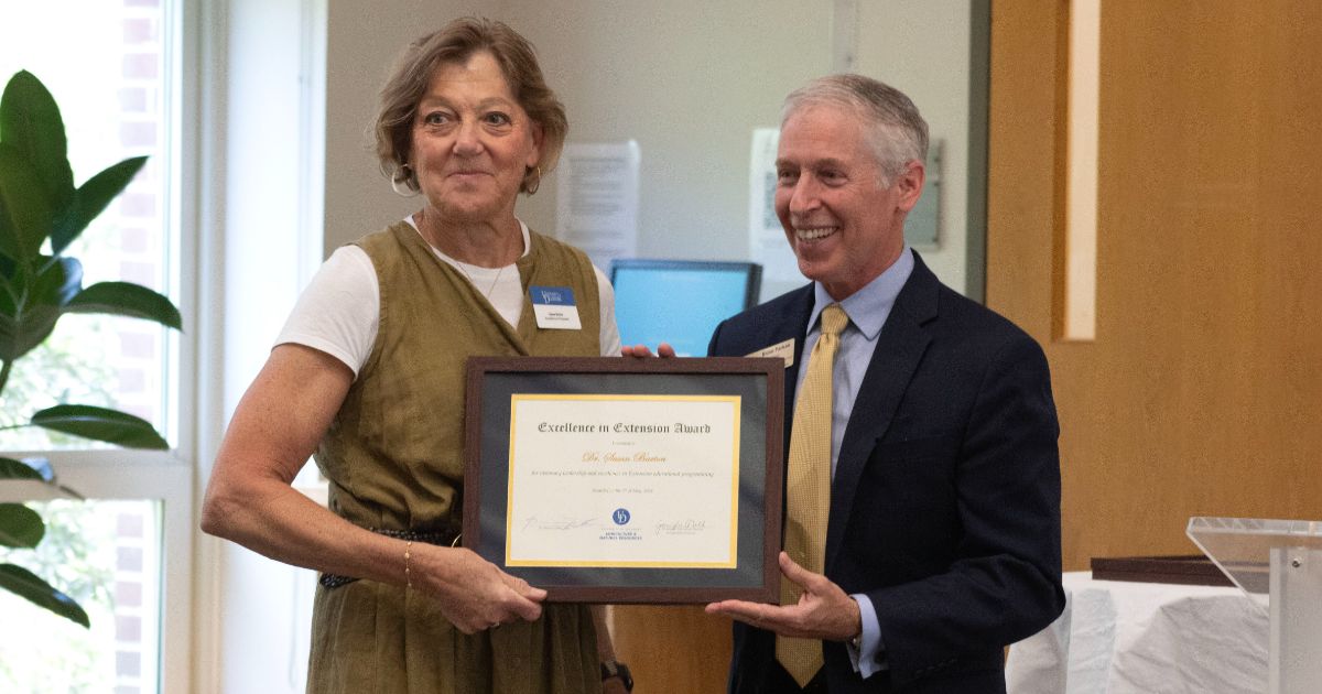 Celebrating Excellence - Sue Barton Brian Farkas presents Sue Barton with the Excellence in Extension Award.