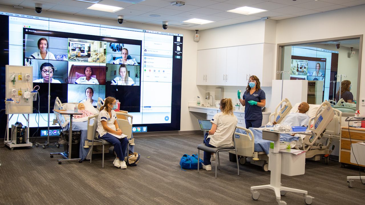 university of delaware health science students in a lab classroom