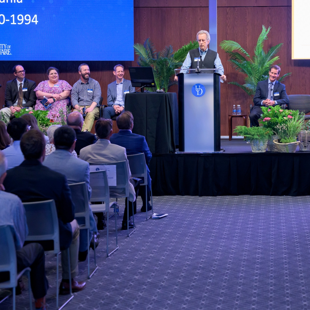 A speaker at the lectern of the Sparks Legacy event.