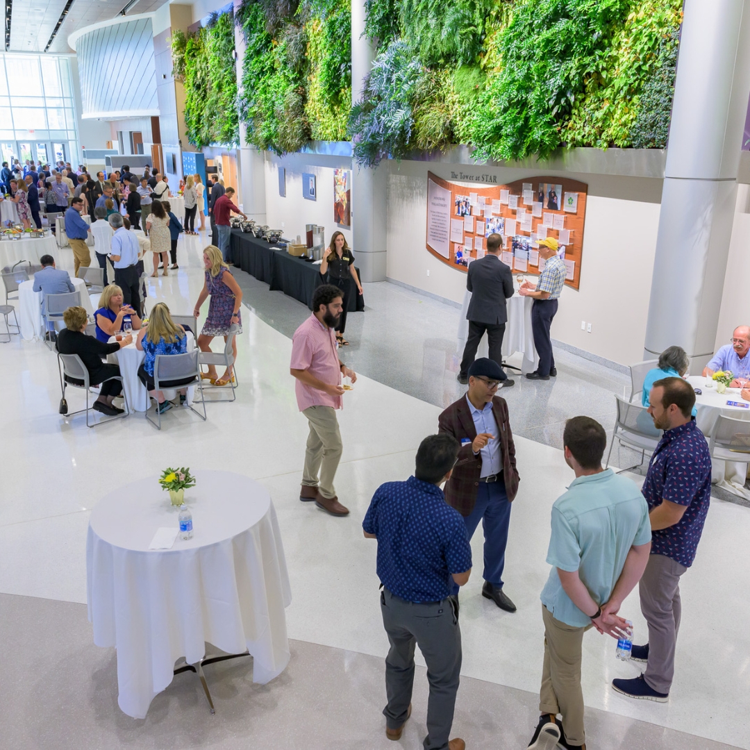 An overview of the event space with people chatting.