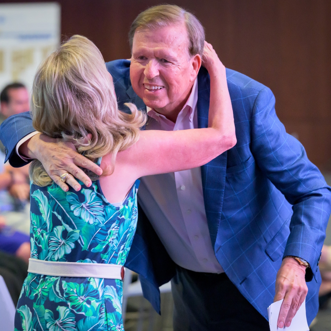 Dr. Robin Morgan hugging Dean Sparks.