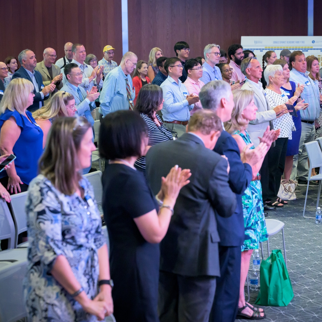 A group clapping for Don.