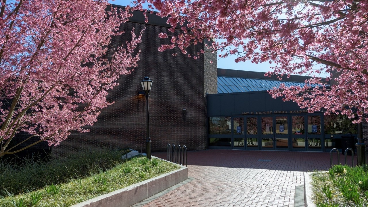 external photo in the spring time of the Amy DuPont Music Building