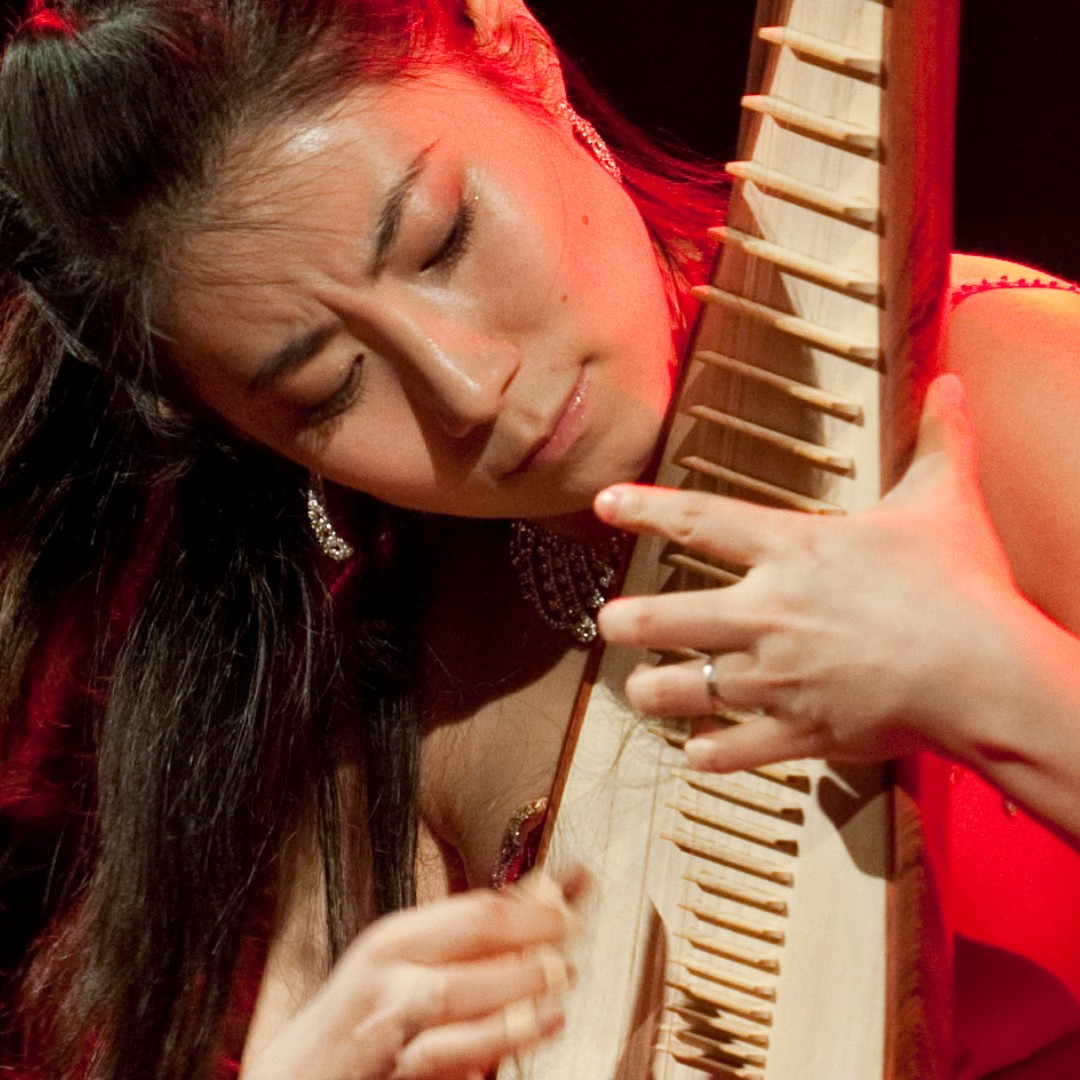 Female closeup with string instrument