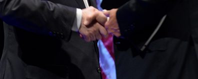 UD President Dennis Assanis shakes hands with President Joe Biden.