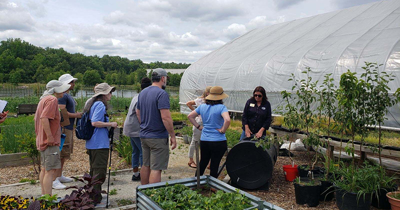 several people attending an outdoor workshop on gardening