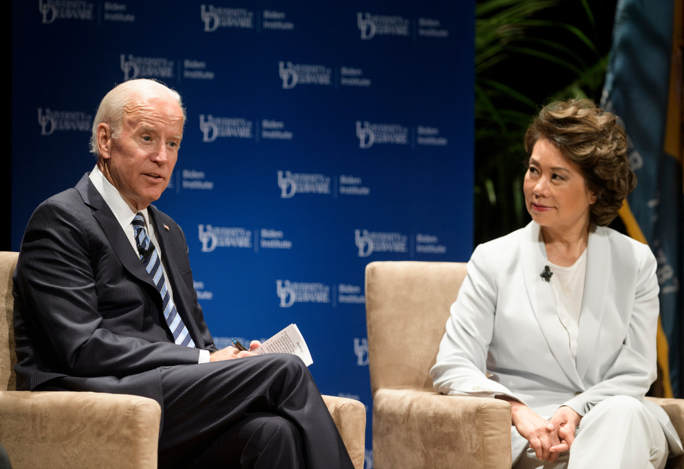 Photo of then-Vice President Joe Biden sitting opposite then-U.S. Secretary of Transportation Elaine Chao onstage at the Choosing a Future of Quality Jobs town hall event