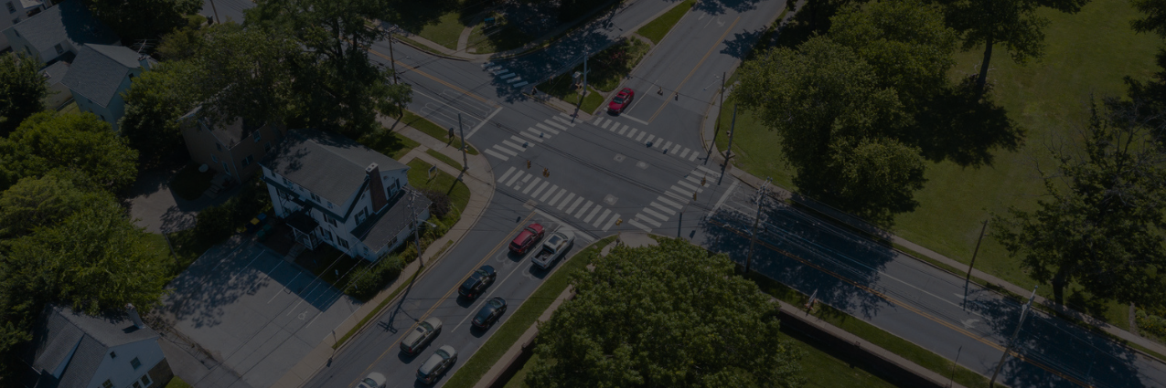 Aerial photo of traffic at a busy intersection in Newark, Delaware , surrounded by buildings and greenery