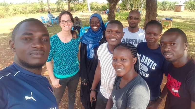 Leah posing for  selfie with a team of local residents in Kenya.