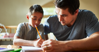 A father helping his son with homework