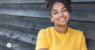 A female teen smiling