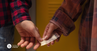 Two teens hands exchanging a substance