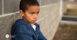 A child with an upset or angry look