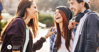 Three teens together laughing