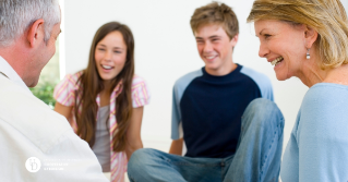 a family of four having a nice conversation together