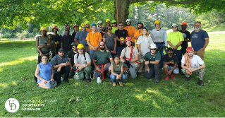 A group of participants from a previous tree climbing school workshop