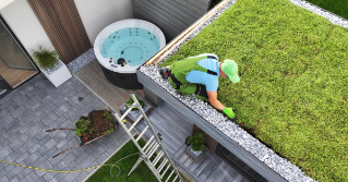 An example of a green roof with a man working on it