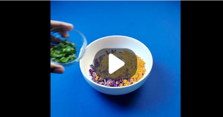 Carrot and red cabbage salad being made