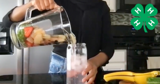 An image of someone pouring water into a glass