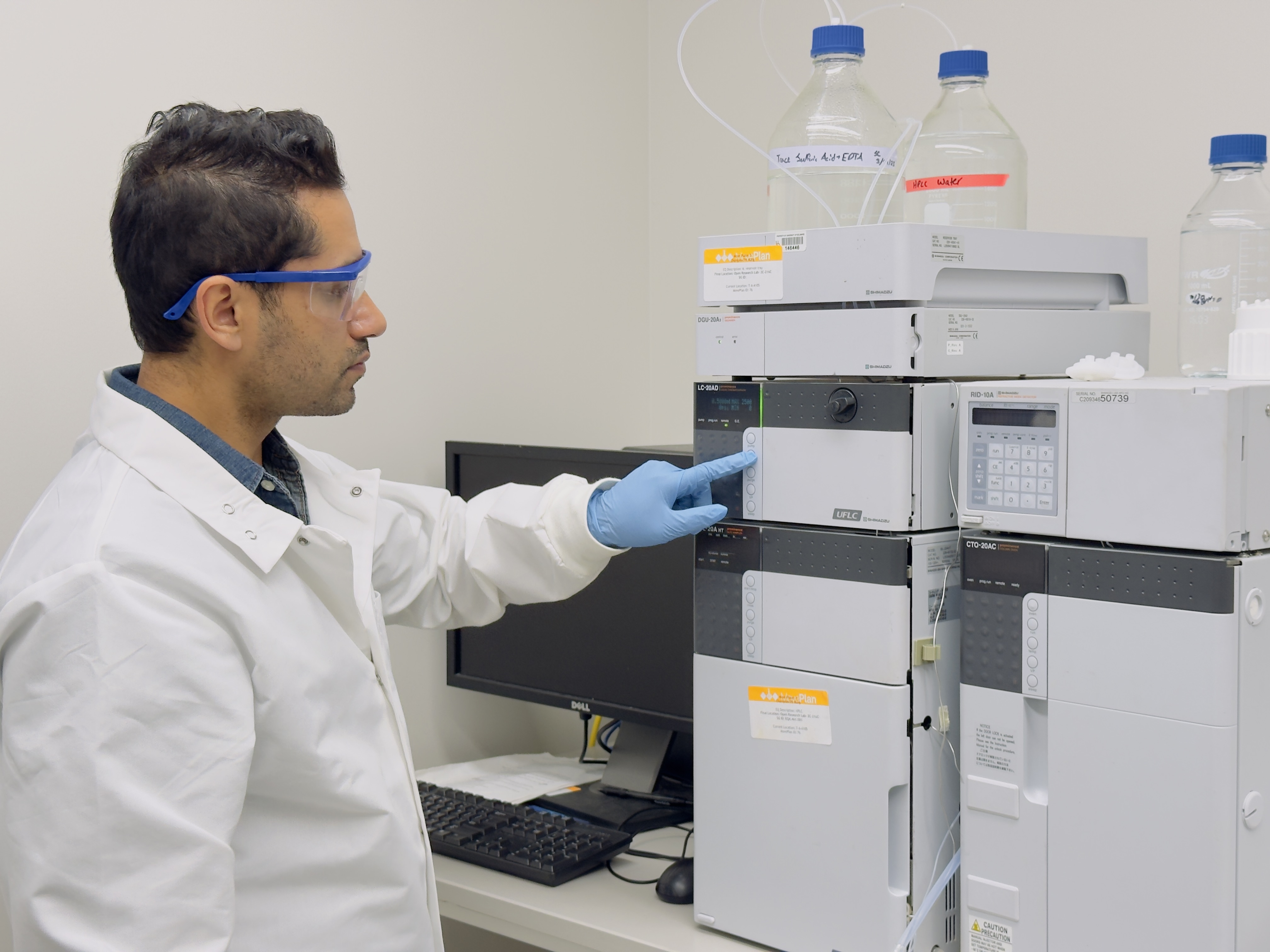 Shafeekh Muyyarikkandy uses a machine to help identify different compounds and help cells grow.