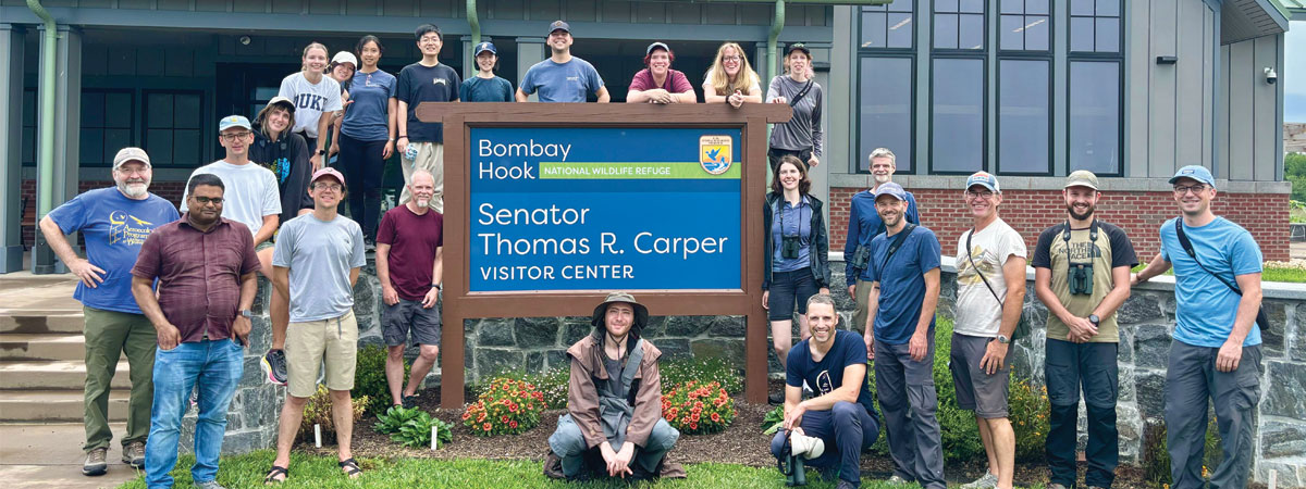 Radar aeroecology researchers stand together for a photo at the Bombay Hook National Wildlife Refuge visitor center.