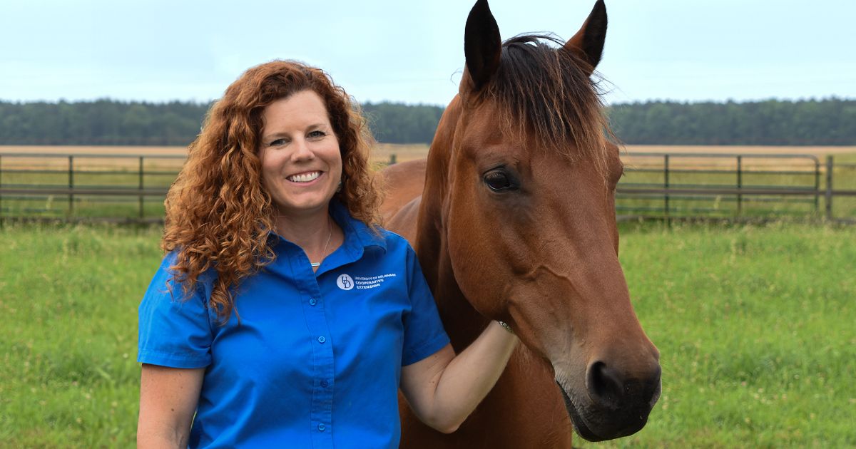 Susan Truehart Garey stands with her horse.