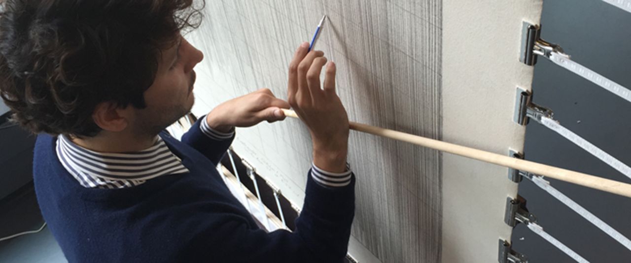 Student working on a wall tapestry