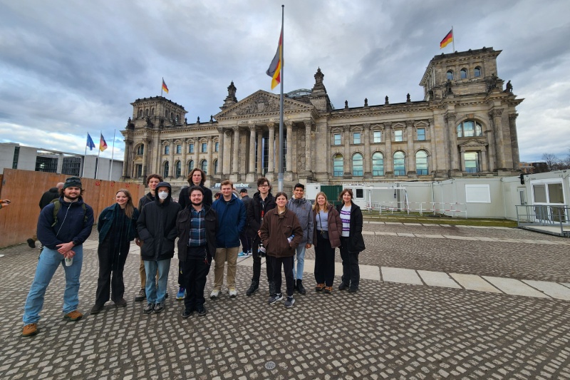 UD students standing outside of large concrete building with many windows in Germany