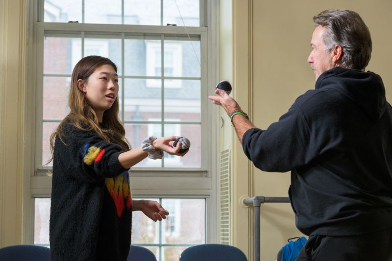 REP actor and professor Lee Ernst works with a student in THEA205 Introduction to Stage Movement. Juggling is one example of a performance technique that teaches students how to focus their attention on stage. 