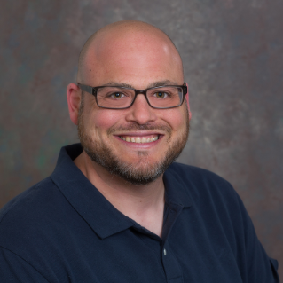 Headshot photo of Scott Caplan