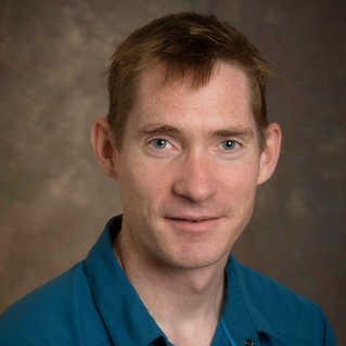 Headshot photo of Keith Schneider