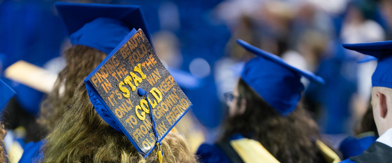 View of blue graduation caps at University of Delaware convocation View of blue graduation caps at University of Delaware convocation