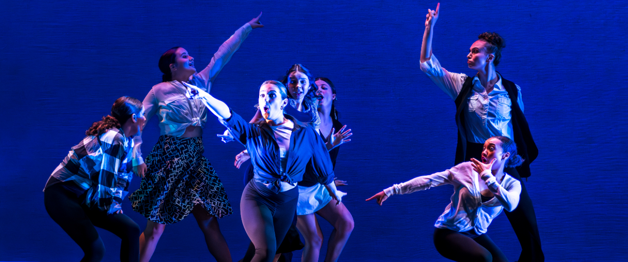 Performance theatre students on stage dancing