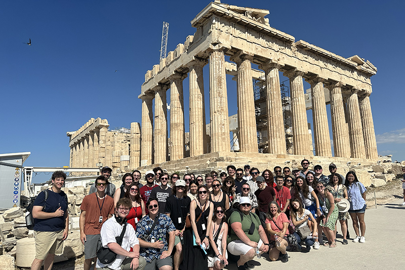 people standing in front of Acropolis in Greece