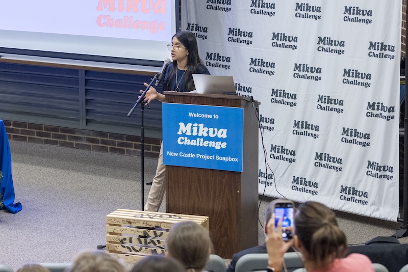 High school student, Gurliv Marok, speaking at podium