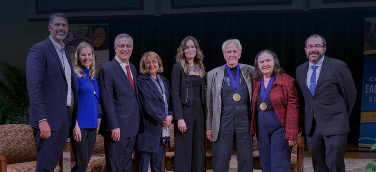 From left to right: Professor Matthew Oliver, Korin Oliver, President Dennis Assanis, First Lady Eleni Assanis, Danielle Haulsee, Charles Robertson, Patricia Robertson and Dean Fabrice Veron.