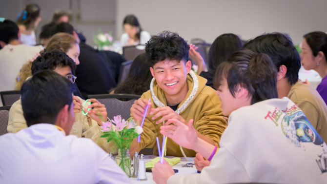 students networking at dinner