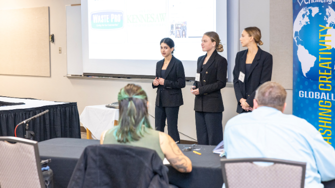 team presenting to a panel of judges