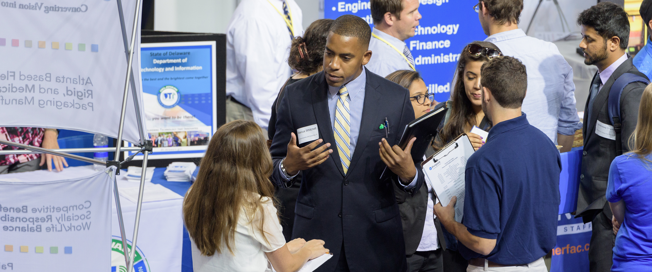 Students speak with employers at a UD Career Fair