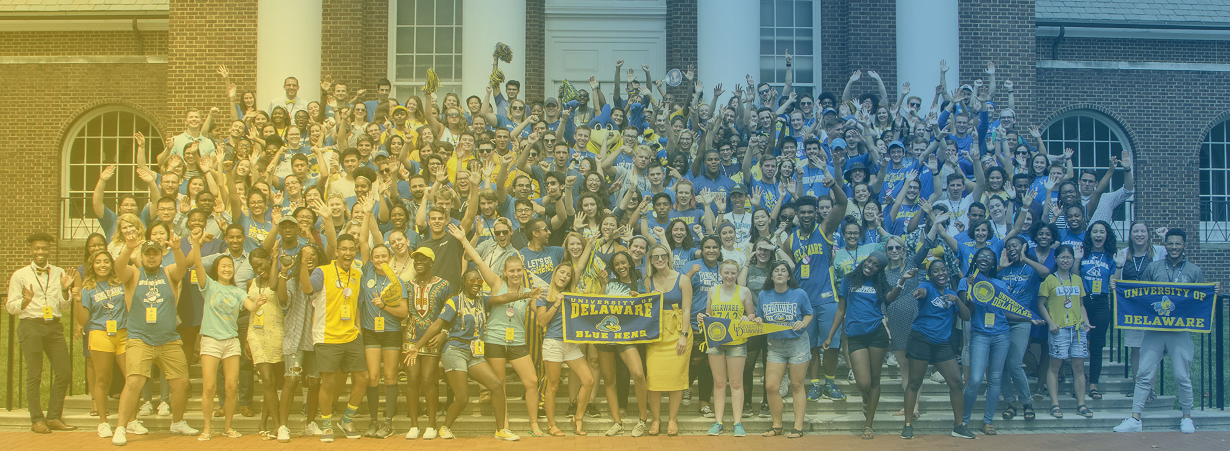 Photo of the 2024-2025 RA staff standing on the steps of Memorial Hall