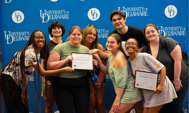 Students holding award certificates